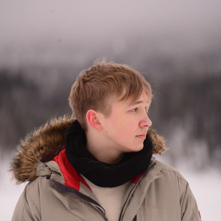 Alex Chen, Lead Design Curator at StreamSteadyGrove, reviewing corporate floral arrangements